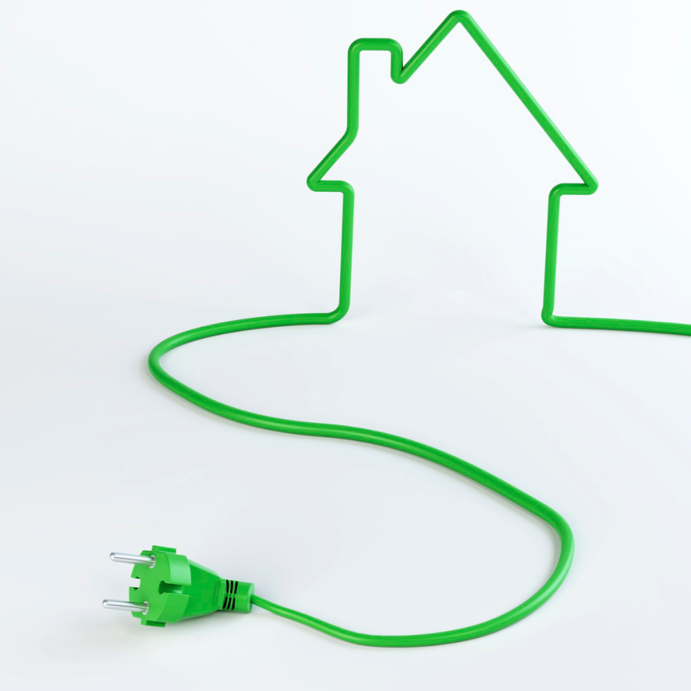 Zielony kabel z wtyczką układający się w kształt domu.